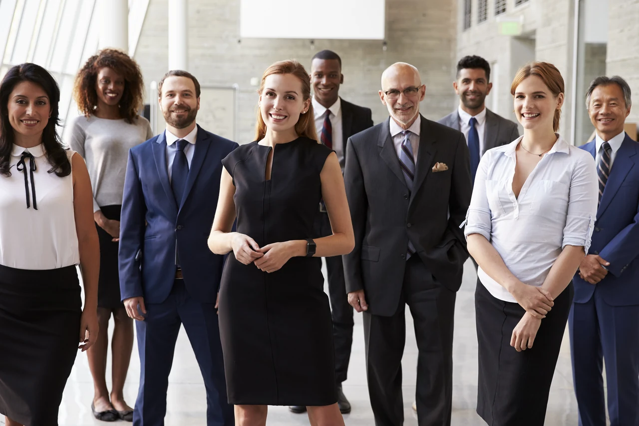 Group of business professionals standing in an office